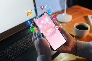 Future of digital marketing in India illustrated with a smartphone displaying social media, email, and digital communication icons.